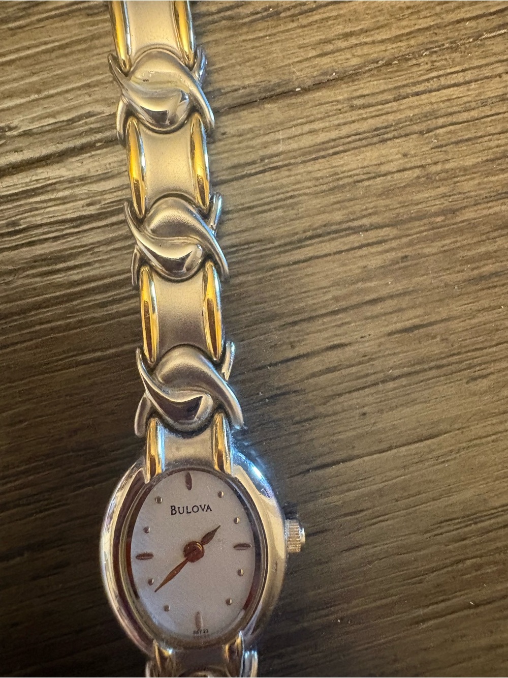 Bulova Two-Tone Silver and Gold Women's Bracelet Watch with Oval White Dial